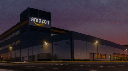 Modern distribution warehouse of a large e-commerce company at sunset.