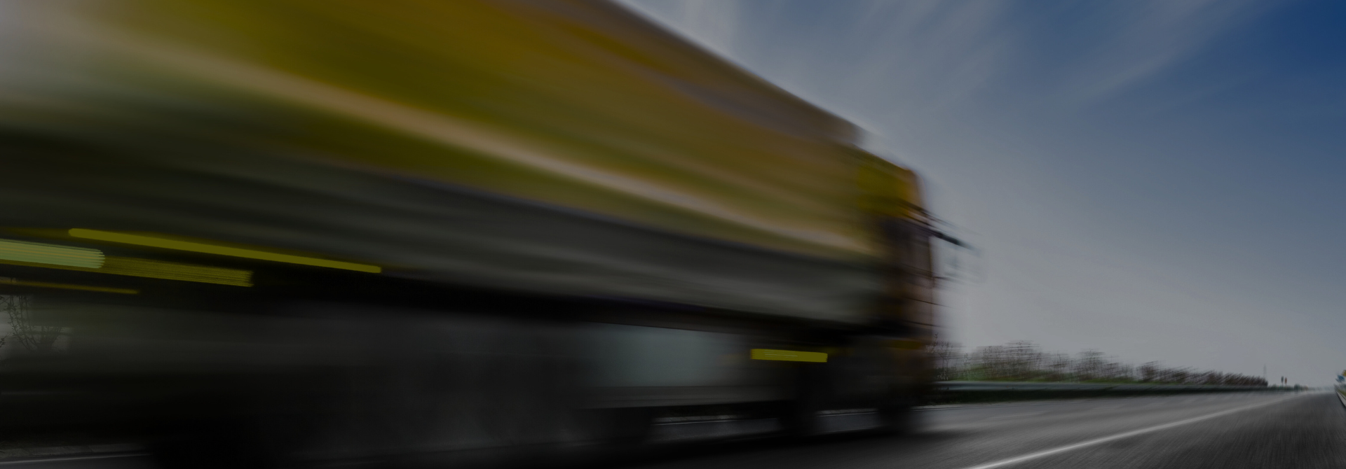Modern logistics truck driving on highway at sunset — symbolizing reliability, speed, and international freight transportation.